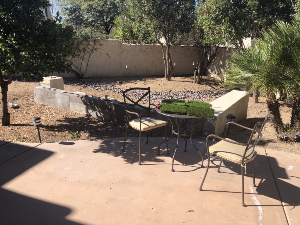 Cave Creek back yard before demolition and travertine installation with artificial turf