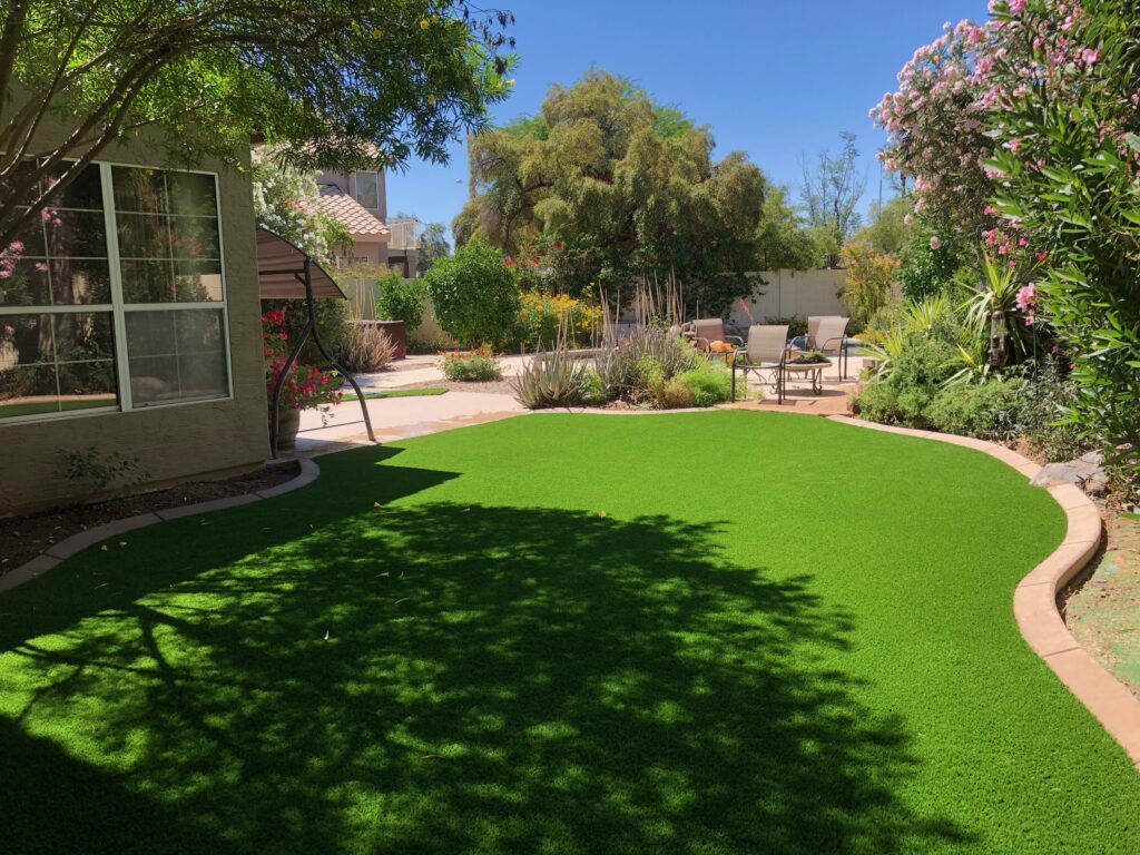back yard Desert Ridge after new green artificial turf for dogs installation with envirofill