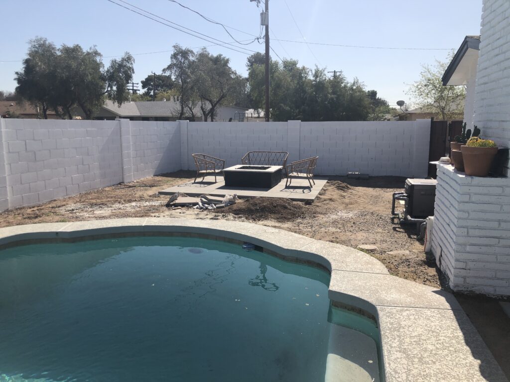 Tempe outdoor living space during renovation and fire pit and artificial turf installation