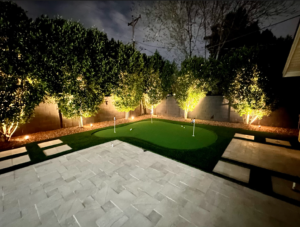 outdoor lights, travertine and putting green landscaping installation in Arcadia